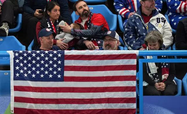 US supporters watch during the gold medal mixed doubles curling match between USA and Sweden, at the 2026 Winter Olympics, in Cortina D'Ampezzo, Italy, Tuesday, Feb. 10, 2026. (AP Photo/Fatima Shbair)