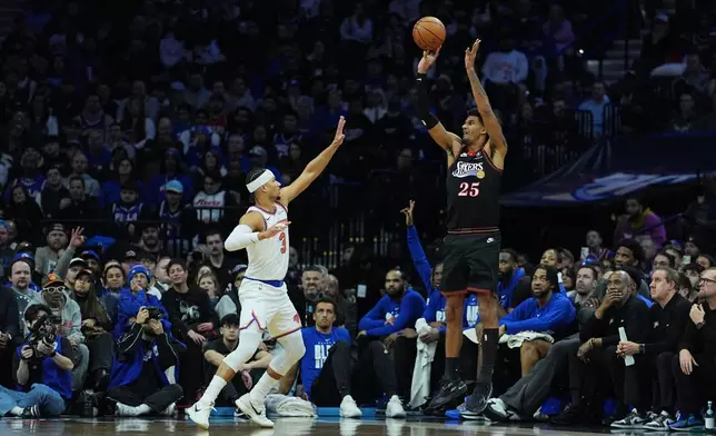 Philadelphia 76ers' Dominick Barlow goes up to shoot against New York Knicks' Josh Hart during the first half of an NBA basketball game, Wednesday, Feb. 11, 2026, in Philadelphia. (AP Photo/Matt Rourke)