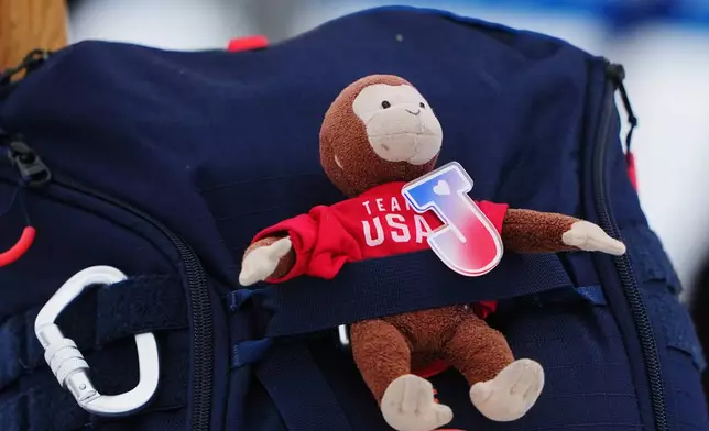 A stuffed monkey is seen on the backpack of United States' Jaelin Kauf before the women's freestyle skiing moguls qualifications at the 2026 Winter Olympics, in Livigno, Italy, Tuesday, Feb. 10, 2026. (AP Photo/Lindsey Wasson)
