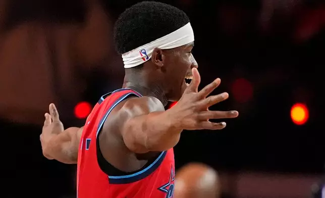 Team Vince guard VJ Edgecombe (77) of the Philadelphia 76ers celebrates during a final in NBA basketball's Rising Stars event against Team Melo, Friday, Feb. 13, 2026, in Inglewood, Calif. (AP Photo/Mark J. Terrill)