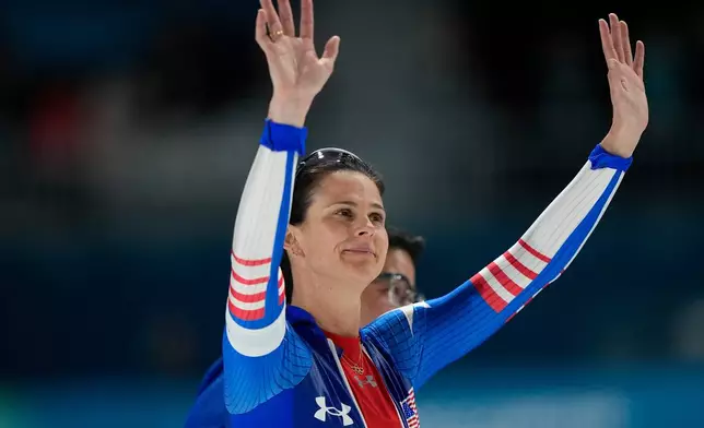 Fourth placed Brittany Bowe of the U.S. and her coach Ryan Shimabukuro, rear, react after the women's 1500 meters speedskating race at the 2026 Winter Olympics, in Milan, Italy, Friday, Feb. 20, 2026. (AP Photo/Ben Curtis)