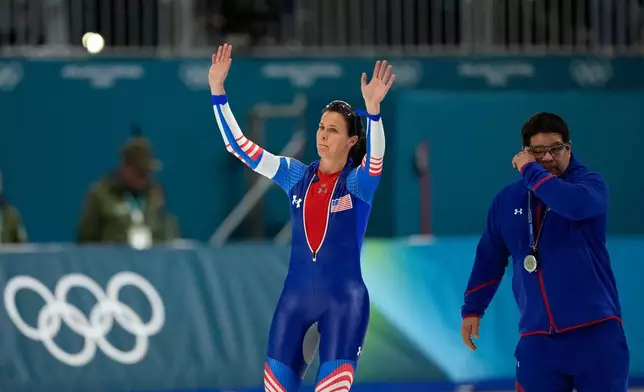 Fourth placed Brittany Bowe of the U.S. and her coach Ryan Shimabukuro react after the women's 1500 meters speedskating race at the 2026 Winter Olympics, in Milan, Italy, Friday, Feb. 20, 2026. (AP Photo/Ben Curtis)