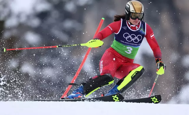 Austria's Katharina Huber speeds down the course during an alpine ski, slalom portion of a women's team combined race, at the 2026 Winter Olympics, in Cortina d'Ampezzo, Italy, Tuesday, Feb. 10, 2026. (AP Photo/Marco Trovati)
