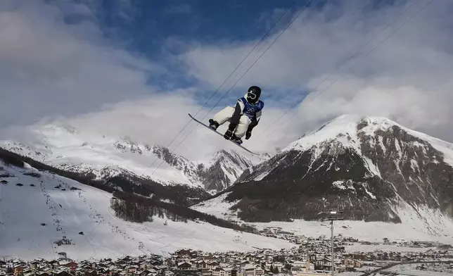 Japan's Ryusei Yamada practices during a snowboarding halfpipe training session at the 2026 Winter Olympics, in Livigno, Italy, Tuesday, Feb. 10, 2026. (AP Photo/Gregory Bull)