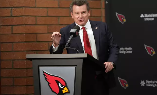 Arizona Cardinals owner Michael Bidwell introduces new head coach Mike LaFleur during an NFL football news conference, Tuesday, Feb. 3, 2026, in Tempe, Ariz. (AP Photo/Rick Scuteri)