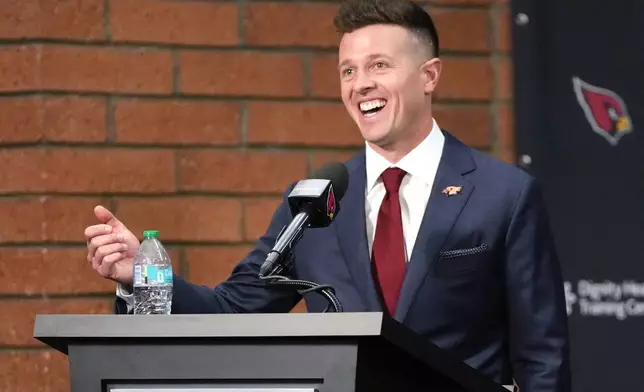 Arizona Cardinals new head coach Mike LaFleur acknowledges the media after being introduced during an NFL football news conference, Tuesday, Feb. 3, 2026, in Tempe, Ariz. (AP Photo/Rick Scuteri)