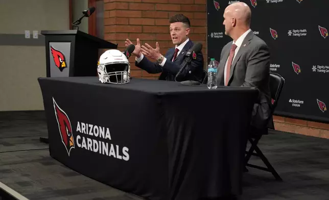 Arizona Cardinals new head coach Mike LaFleur, left, and general manager Monti Ossenfort speak during an NFL football news conference, Tuesday, Feb. 3, 2026, in Tempe, Ariz. (AP Photo/Rick Scuteri)
