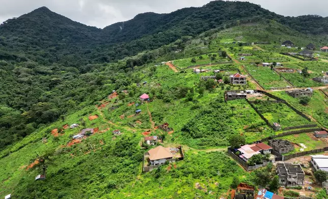 An aerial view of constructions near Tacugama Chimpanzee Sanctuary in Western Area Peninsula National Park, Sierra Leone, Friday, July 4, 2025. (AP Photo/Misper Apawu)