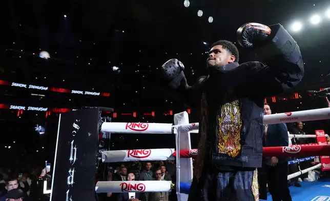 CORRECTS THE NAME TO SHAKUR, NOT SHADUR - Shakur Stevenson gestures before a super lightweight title boxing match against Teofimo Lopez Sunday, Feb. 1, 2026, in New York. (AP Photo/Frank Franklin II)