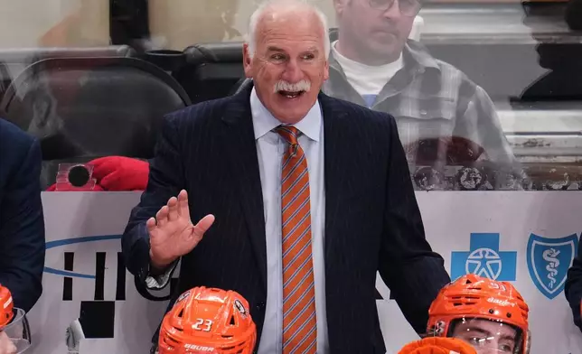 FILE -Anaheim Ducks head coach Joel Quenneville gives instructions during the overtime period of an NHL hockey game against the Pittsburgh Penguins in Pittsburgh, Dec. 9, 2025. (AP Photo/Gene J. Puskar, File)