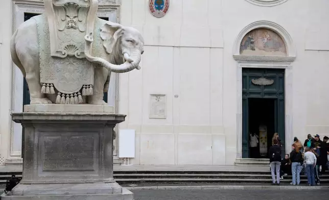 The iconic Elephant and Obelisk monument in Rome, designed by Baroque sculptor Gian Lorenzo Bernini, is seen without the tip of the left tusk on Wednesday, Feb. 18, 2026, after Police found an 11-centimeter (4-inch) marble fragment near the statue over the weekend. (Cecilia Fabiano/Lapresse via AP)