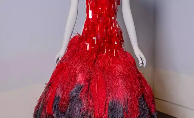 An Alexander McQueen dress is displayed in preparation for The Metropolitan Museum of Art's spring exhibition, "Costume Art," on Thursday, Feb. 12, 2026, in New York. (Photo by Charles Sykes/Invision/AP)