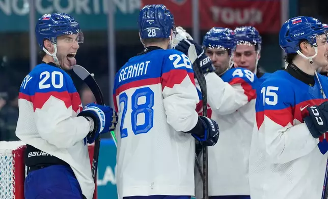 Slovakia's Juraj Slafkovsky end of a preliminary round match of men's ice hockey between Sweden and Slovakia at the 2026 Winter Olympics, in Milan, Italy, Saturday, Feb. 14, 2026. (AP Photo/Petr David Josek)