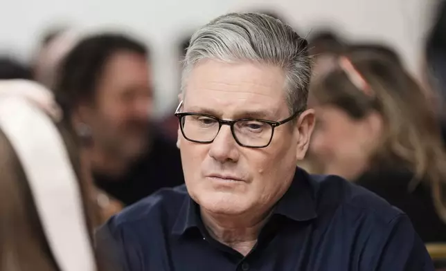 Britain's Prime Minister Keir Starmer meets local party members, in London, Friday, Feb. 27, 2026. (Stefan Rousseau/PA via AP)