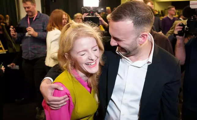 CORRECTS DATE - Greens Party candidate Hannah Spencer, left, stands with party leader Zack Polanski after winning the Gorton and Denton by-election, Manchester, England, Friday, Feb. 27, 2026. (AP Photo/Jon Super)