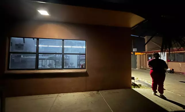 Immigrant families settle in for the night at the Holding Institute in Laredo, Texas, on Feb. 12, 2026. (AP Photo/Valerie Gonzalez)