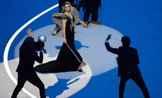 Italian actor Matilda De Angelis performs during the Olympic opening ceremony at the 2026 Winter Olympics, in Milan, Italy, Friday, Feb. 6, 2026. (AP Photo/Ben Curtis)