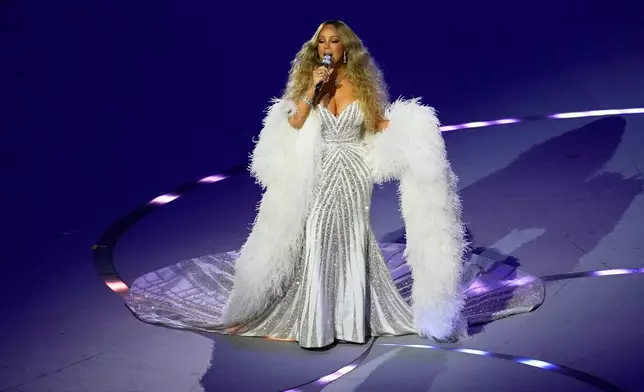 Singer Mariah Carey performs during the Olympic opening ceremony at the 2026 Winter Olympics, in Milan, Italy, Friday, Feb. 6, 2026. (AP Photo/Petr David Josek)