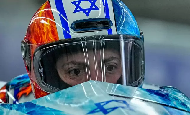 Israel's Adam Edelman, front, and Menachem Chen start for a two man bobsled run at the 2026 Winter Olympics, in Cortina d'Ampezzo, Italy, Monday, Feb. 16, 2026. (AP Photo/Alessandra Tarantino)