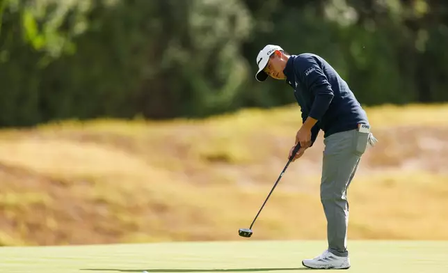 Collin Morikawa chips on the eighth green during the first round of the Genesis Invitational golf tournament at Riviera Country Club, Thursday, Feb. 19, 2026, in the Pacific Palisades area of Los Angeles. (AP Photo/Caroline Brehman)