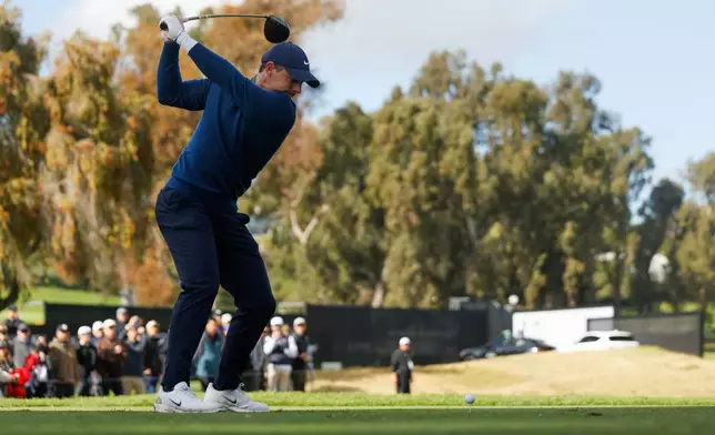 Rory McIlroy, from Northern Ireland, hits from the ninth tee during the first round of the Genesis Invitational golf tournament at Riviera Country Club, Thursday, Feb. 19, 2026, in the Pacific Palisades area of Los Angeles. (AP Photo/Caroline Brehman )