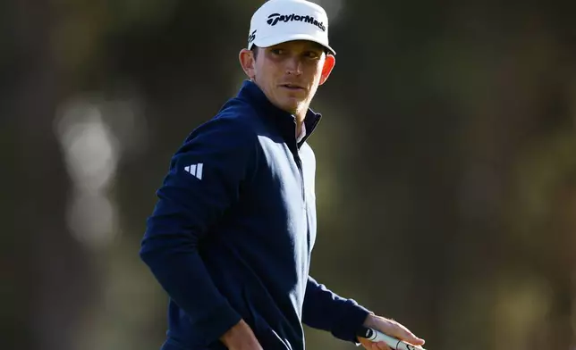Jacob Bridgeman walks off the 18th green during the first round of the Genesis Invitational golf tournament at Riviera Country Club, Thursday, Feb. 19, 2026, in the Pacific Palisades area of Los Angeles. (AP Photo/Caroline Brehman)