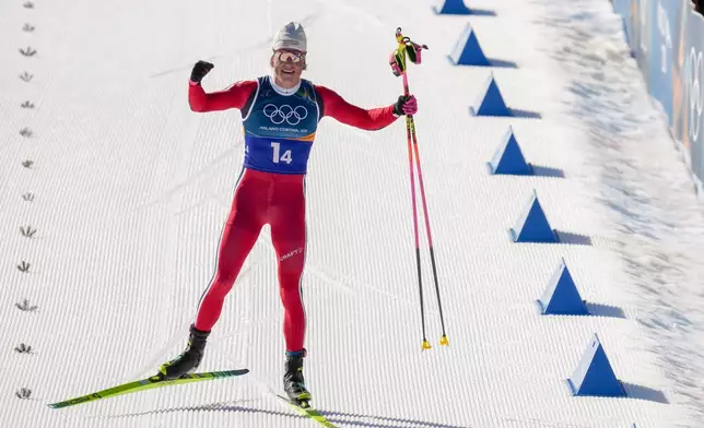 Johannes Hoesflot Klaebo, of Norway, approaches the finish line to win the gold medal in the cross country skiing men's 4 x 7.5km relay at the 2026 Winter Olympics, in Tesero, Italy, Sunday, Feb. 15, 2026. (AP Photo/Evgeniy Maloletka)