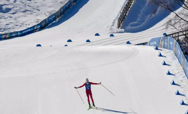 Johannes Hoesflot Klaebo, of Norway, approaches the finish line to win the gold medal in the cross country skiing men's 4 x 7.5km relay at the 2026 Winter Olympics, in Tesero, Italy, Sunday, Feb. 15, 2026. (AP Photo/Evgeniy Maloletka)