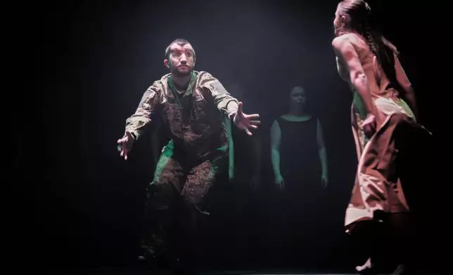 Andrii Onopriienko, who lost his eyesight in combat during Russia's full-scale invasion in Ukraine, performs during the premiere of an adaptation of Ivan Kotliarevskyi’s “Eneida,” a Ukrainian reimagining of Virgil’s “Aeneid,” in Kyiv, Ukraine, Thursday, Feb. 19, 2026. (AP Photo/Efrem Lukatsky)