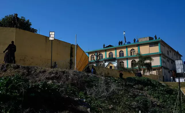 Police commandos take position on a Shiite mosque, the site of Friday's suicide bombing, in Islamabad, Pakistan, Saturday, Feb. 7, 2026. (AP Photo/Anjum Naveed)