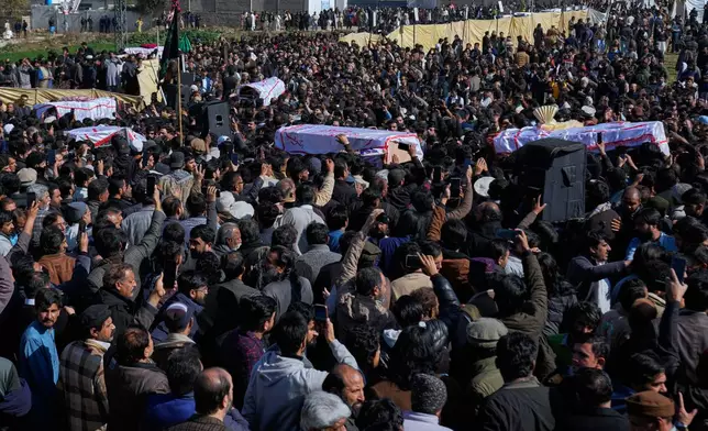 Mourners carry coffins of the victims of Friday's suicide bombing inside a Shiite mosque, after a funeral prayer, in Islamabad, Pakistan, Saturday, Feb. 7, 2026. (AP Photo/Anjum Naveed)