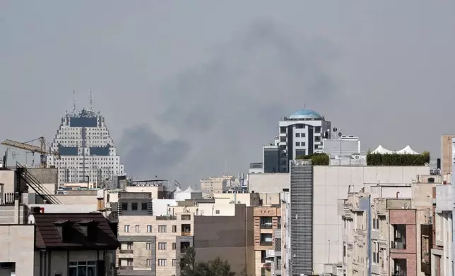 Smoke rises on the skyline after an explosion in Tehran, Iran, Saturday, Feb. 28, 2026.(AP Photo/Vahid Salemi)