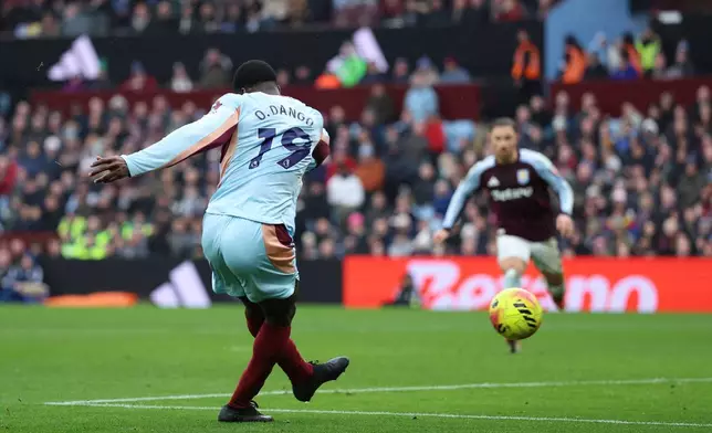 Brentford's Dango Ouattara scores during the English Premier League soccer match between Aston Villa and Brentford, in Birmingham, England, Sunday, Feb. 1, 2026. (Nigel French/PA via AP)