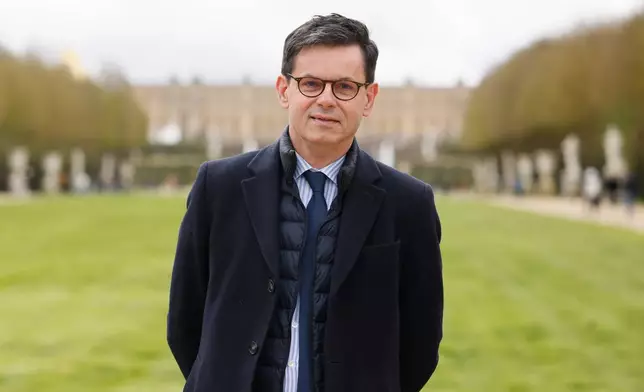 FILE Christophe Leribault, head of the Charteau de Versailles, poses March 29, 2024 in the park of the Chateau de Versailles, west of Paris. (AP Photo/Thomas Padilla, File)