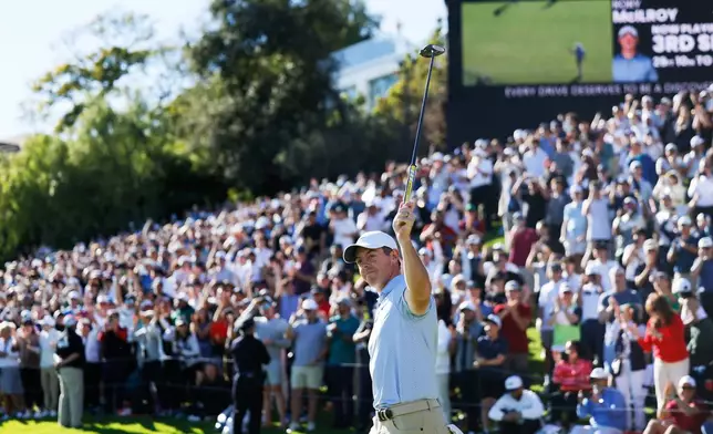 Rory McIlroy, from Northern Ireland, raises his putter to the gallery after the final round of the Genesis Invitational golf tournament at Riviera Country Club, Sunday, Feb. 22, 2026, in the Pacific Palisades area of Los Angeles. (AP Photo/Caroline Brehman)