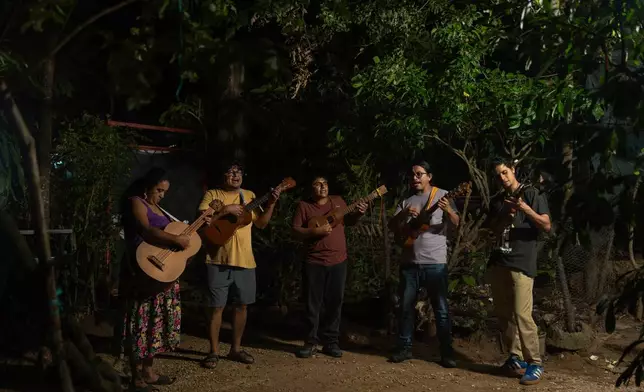 Members of the Altepee collective of musicians and activists perform in an effort to bring awareness through their music about defending their territory against infrastructure projects in Acayucan, Veracruz, Mexico, Oct. 27, 2025. (AP Photo/Felix Marquez)