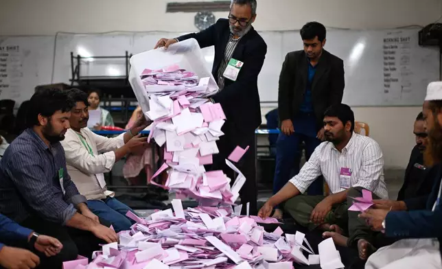 Polling officials begin the counting of votes cast for the national parliamentary election in Dhaka, Bangladesh, Thursday, Feb. 12, 2026. (AP Photo/Mahmud Hossain Opu)
