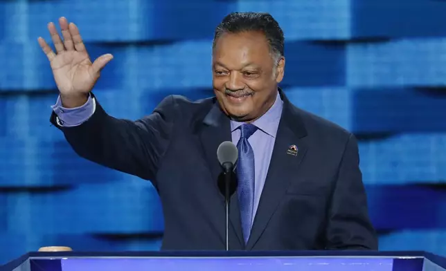 FILE - Rev. Jesse Jackson waves as he steps to the podium during the third day of the Democratic National Convention in Philadelphia, July 27, 2016. (AP Photo/J. Scott Applewhite)