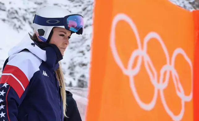United States' Lindsey Vonn concentrates ahead of an alpine ski, women's downhill official training, at the 2026 Winter Olympics, in Cortina d'Ampezzo, Italy, Friday, Feb. 6, 2026. (AP Photo/Marco Trovati)