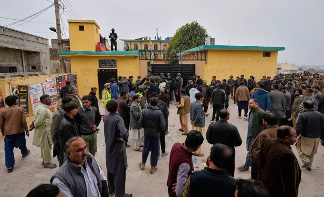 Pakistani security officers and rescue worker gather at the site of a bomb explosion at a Shiite mosque, in Islamabad, Pakistan, Friday, Feb. 6, 2026. (AP Photo/Anjum Naveed)