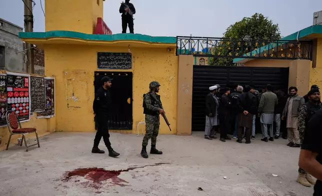Pakistani paramilitary and police commandos take positions at the site of a bomb explosion at a Shiite mosque, in Islamabad, Pakistan, Friday, Feb. 6, 2026. (AP Photo/Anjum Naveed)