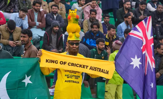Fans cheer during the second T20 cricket match between Pakistan and Australia, in Lahore, Pakistan, Saturday, Jan. 31, 2026. (AP Photo/K.M. Chaudary)