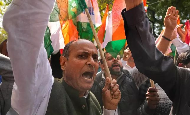 Members of trade unions shout slogans during a nationwide strike to protest an interim trade deal with the United States, saying the agreement undermines the interests of farmers, small businesses and workers in New Delhi, India, Thursday, Feb. 12, 2026. (AP Photo/Manish Swarup)