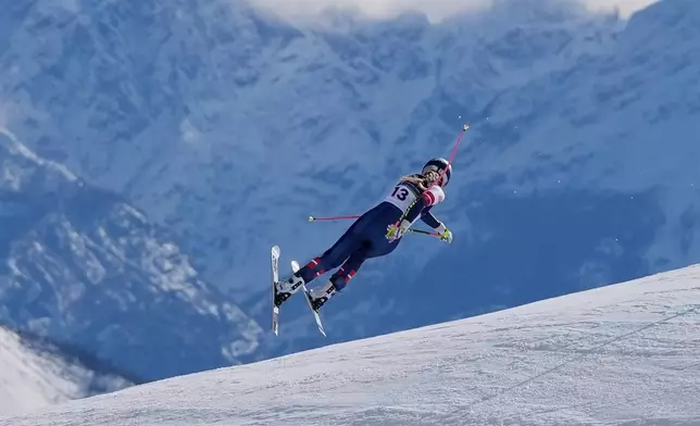 United States' Lindsey Vonn crashes during an alpine ski women's downhill race, at the 2026 Winter Olympics, in Cortina d'Ampezzo, Italy, Sunday, Feb. 8, 2026. (AP Photo/Jacquelyn Martin)