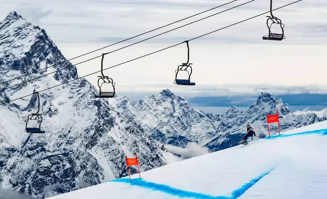 United States' Lindsey Vonn speeds down the course during an alpine ski, women's downhill official training, at the 2026 Winter Olympics, in Cortina d'Ampezzo, Italy, Friday, Feb. 6, 2026. (Jean-Christophe Bott/Keystone via AP)