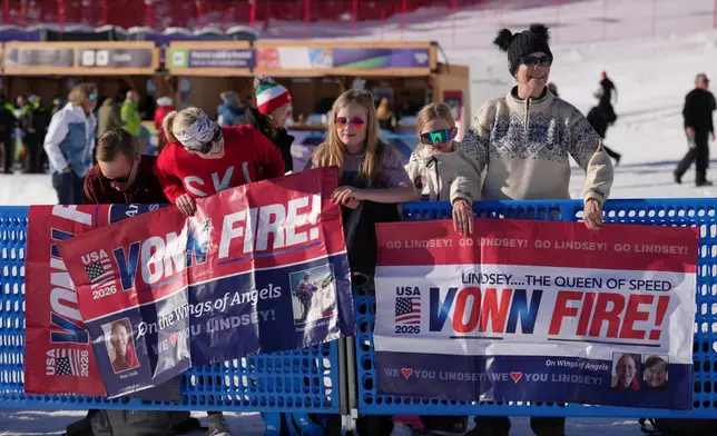 United States' Lindsey Vonn's aunt Lisa Krohn, right, is seen at the finish area of an alpine ski women's downhill race, at the 2026 Winter Olympics, in Cortina d'Ampezzo, Italy, Sunday, Feb. 8, 2026. (AP Photo/Andy Wong)