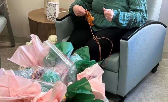 Joelle Haley crochets at the Children's Hospital of Michigan Neonatal Intensive Care Unit at DMC Hutzel Women's Hospital in Detroit, Thursday, Feb. 26, 2026. (AP Photo/Corey Williams)