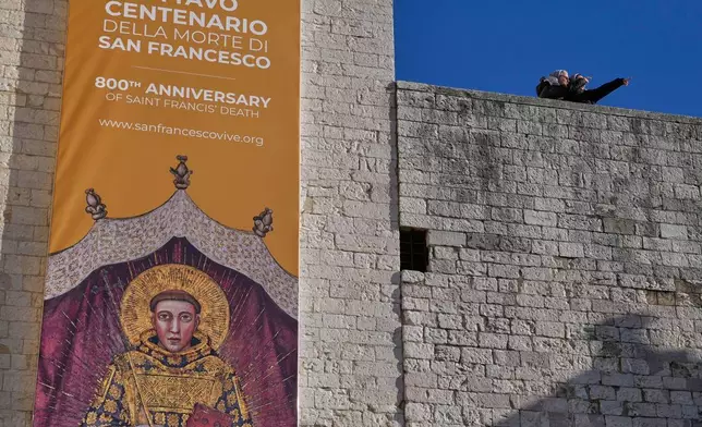 Nuns stand outside the St. Francis Basilica where the bones of the Saint are on the first public display marking the 800th anniversary of his death, in Assisi, Italy, Sunday, Feb. 22, 2026.(AP Photo/Gregorio Borgia)
