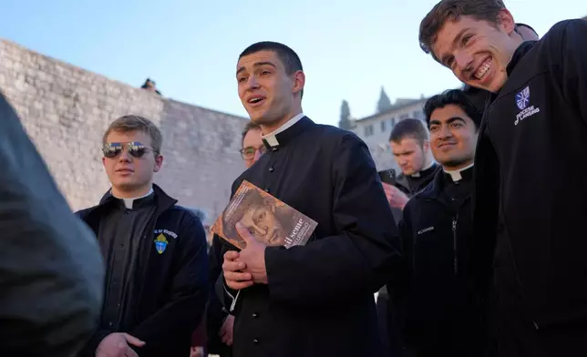 Seminarians from the Dioceses of Rockford, Illinois, and Lansing, Michigan, United States, leave after they honored the bones of St. Francis during the first public display inside the St. Francis Basilica, marking the 800th anniversary of the saint 's death, in Assisi, Italy, Sunday, Feb. 22, 2026.(AP Photo/Gregorio Borgia)