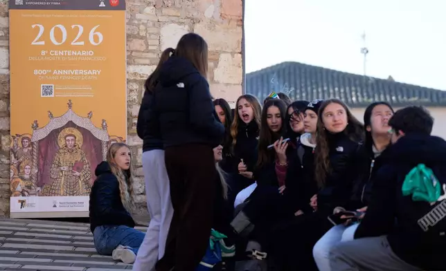 Pilgrims leave after they honored the bones of St. Francis during the first public display inside the St. Francis Basilica, marking the 800th anniversary of the saint's death, in Assisi, Italy, Sunday, Feb. 22, 2026.(AP Photo/Gregorio Borgia)
